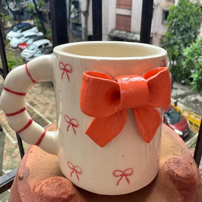 Beautiful Crafted Orange And Red Bow Mug